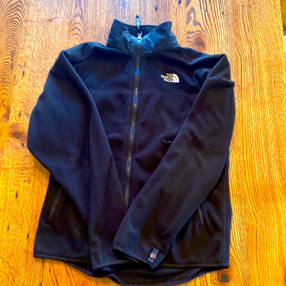 Large black women’s fleece North Face Jacket. Good condition.